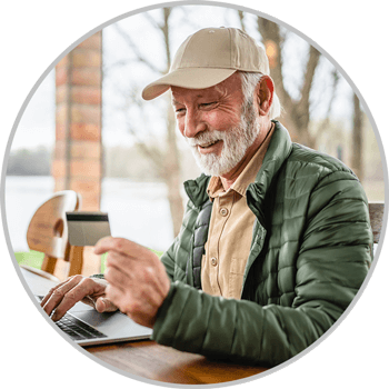 Man using debit card to make online payment