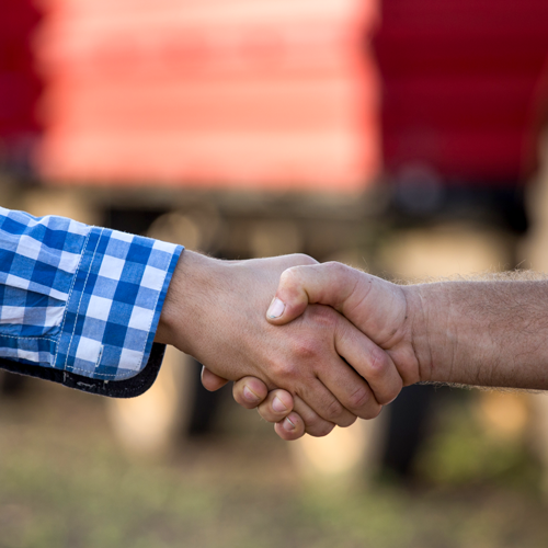 Farmer and Representative Shaking Hands
