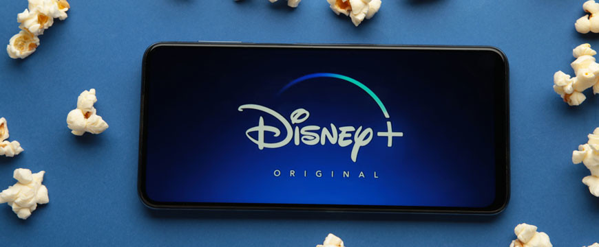 Phone with Disney+ Logo and Popcorn Around Phone