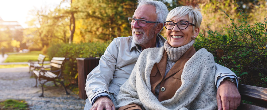 Couple Sitting on Park Bench