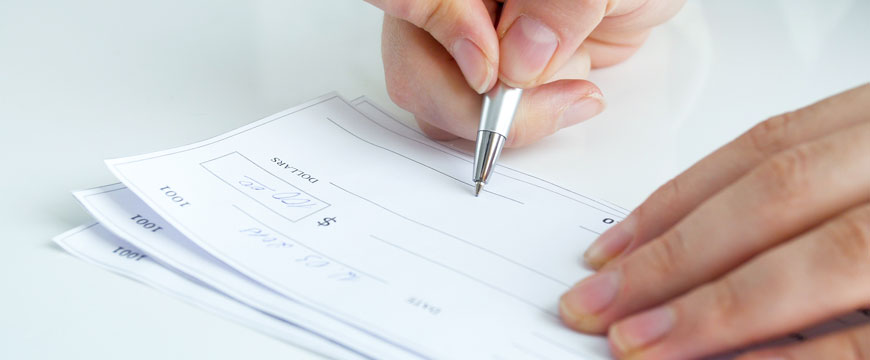 Person Writing a Check