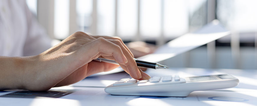 Person Working on Their Finances with Calculator