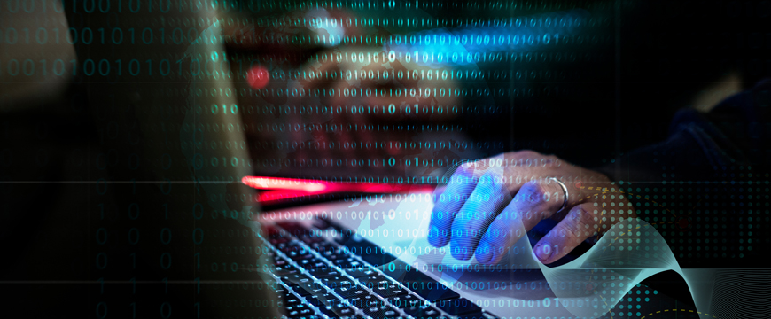 Scammer working on a computer