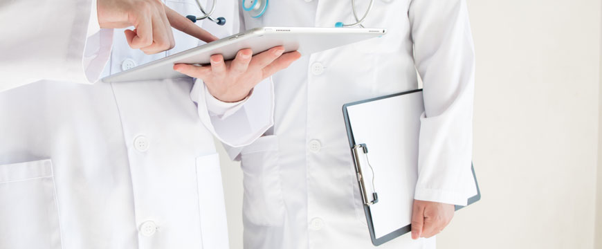 Doctors Looking at Patient Charts