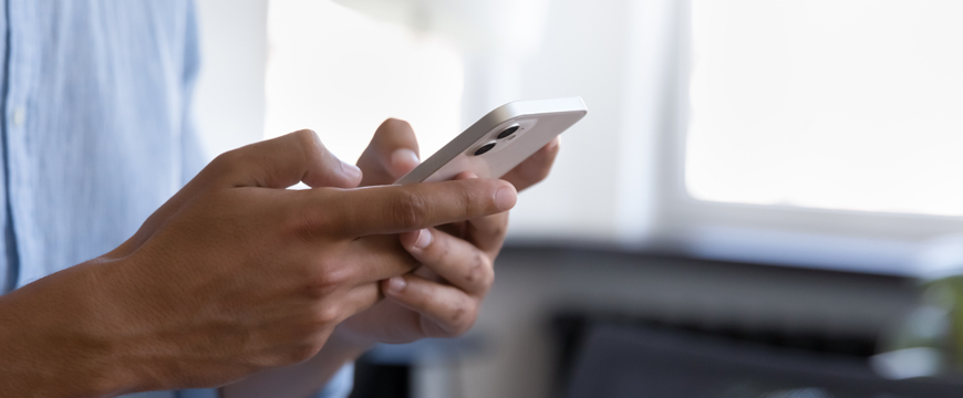 Close up of person checking their mobile device