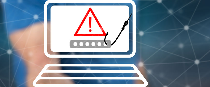 Persons Hand Holding A Malicious Computer