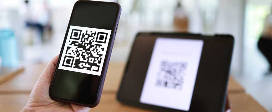 Hand with Phone Scanning QR Code