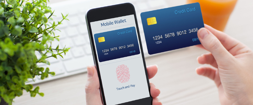 Mobile Wallet and P2P, image of a person's hands holding a mobile phone and card 