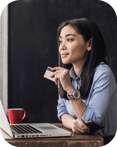 Woman holding debit card for online payment