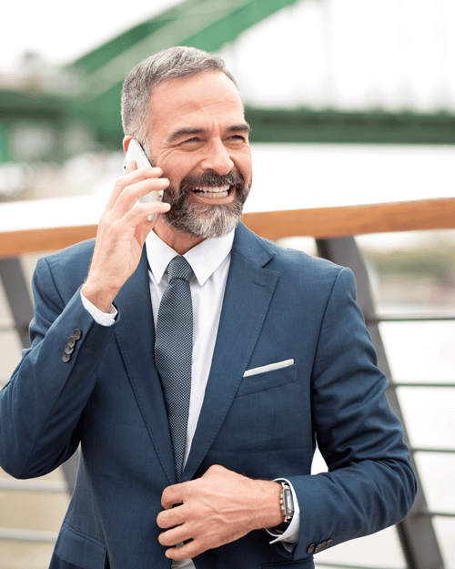 Man making a phone call on a bridge