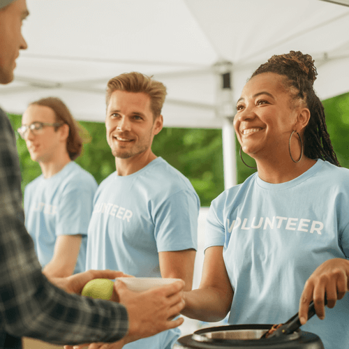 Volunteers serving food