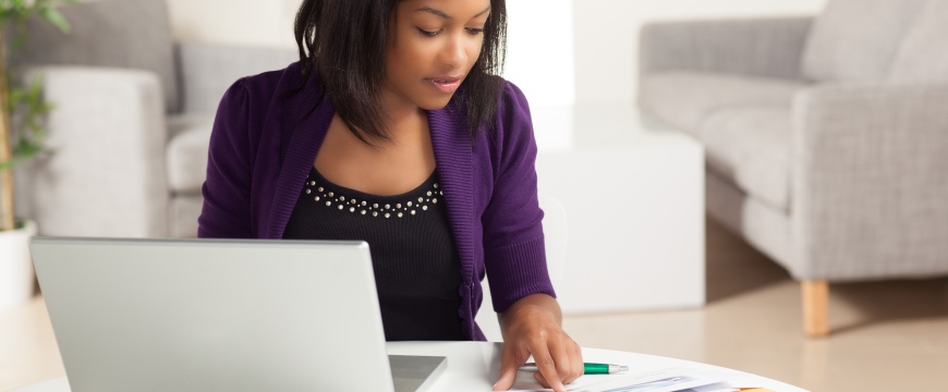 Business Online Banking, image of business woman on computer checking data in office
