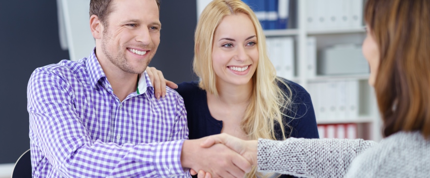 Power Banking, happy couple shaking hands with banker
