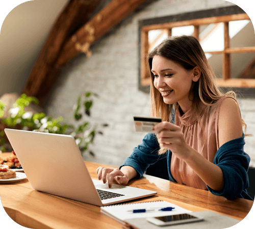 Woman using debit card to pay online