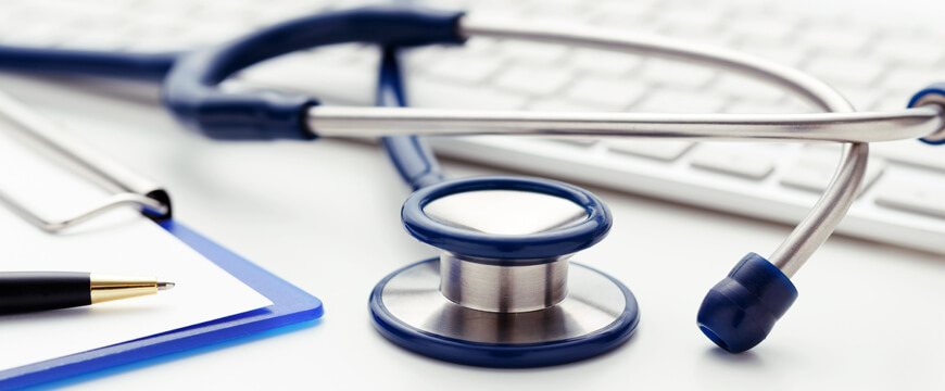 Health Savings Account Image of medical stethoscope, clipboard and computer keyboard