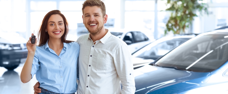 Auto Loans Couple with car keys in hand