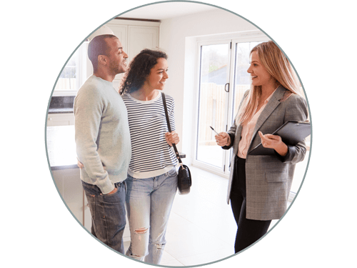 Couple in kitchen talking to realtor