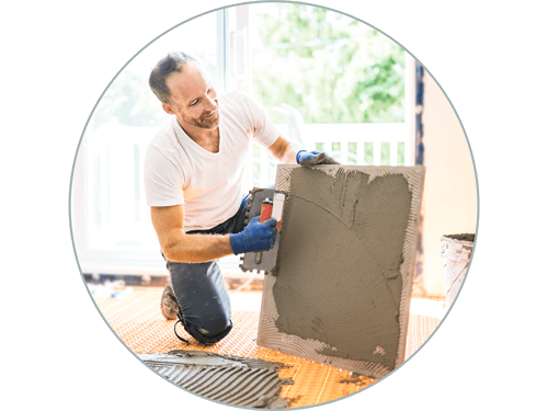 Man laying new tile