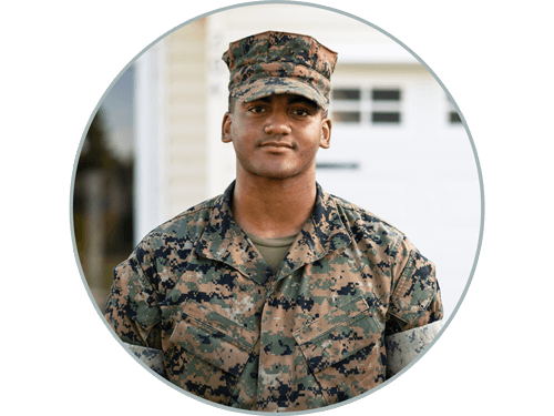 Marine standing in front of home