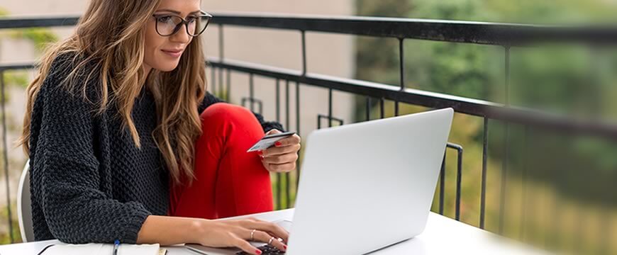 Checking,a young adult is working from her computer outside